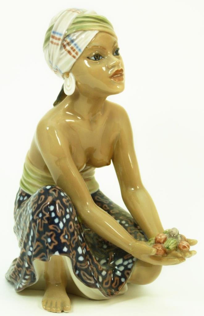 DAHL JENSEN FIGURINE OF AN ISLAND WOMAN: Dahl Jensen figurine of an island woman. Bears the Dahl Jensen green mark to base. Measures approx 8 1/2" (21.59cm) Height. Total approx weight 827g.