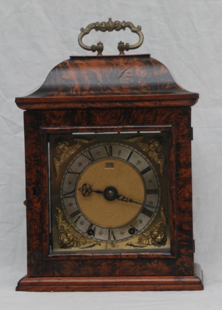 GERMAN SECESSIONIST BURLWOOD MANTEL CLOCK: German Secessionist burl wood case mantle clock. Measures approx. 14 1/2" height x 9 1/2" width x 6 1/2" depth (36.8cm x 24cm x 16.5cm). Total weight approx. 4.25 kilograms.