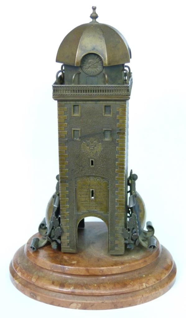 1896 OSTERN GERMAN BRONZE SOUVENIR BRONZE TOWER: Antique German bronze tower sculpture depicting a clock tower. Marked 'Ostern 1896' to shield on side. Other shield marked 'Munsch u. Max.' Mounted on red marble base. Measures approx. 5" height + 3/4