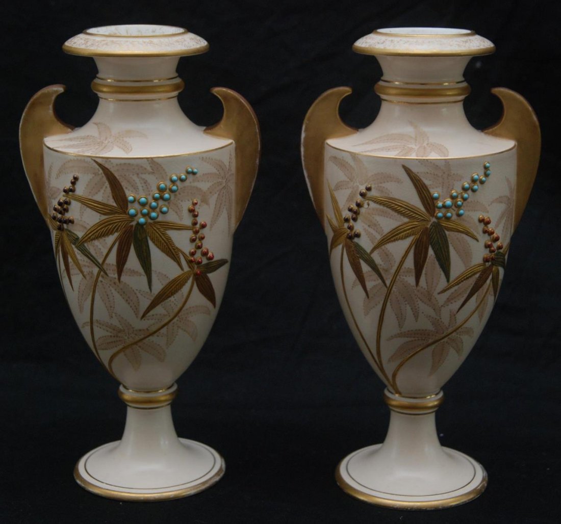 ROYAL WORCESTER ENGLISH PORCELAIN JAPONISM VASES: A pair of Royal Worcester English porcelain Japonisme floral vases with heavy enamel beaded design accenting gilt hand painted floral leaf designs. Circa 19th century. Measures approx. 8 5/8" height (
