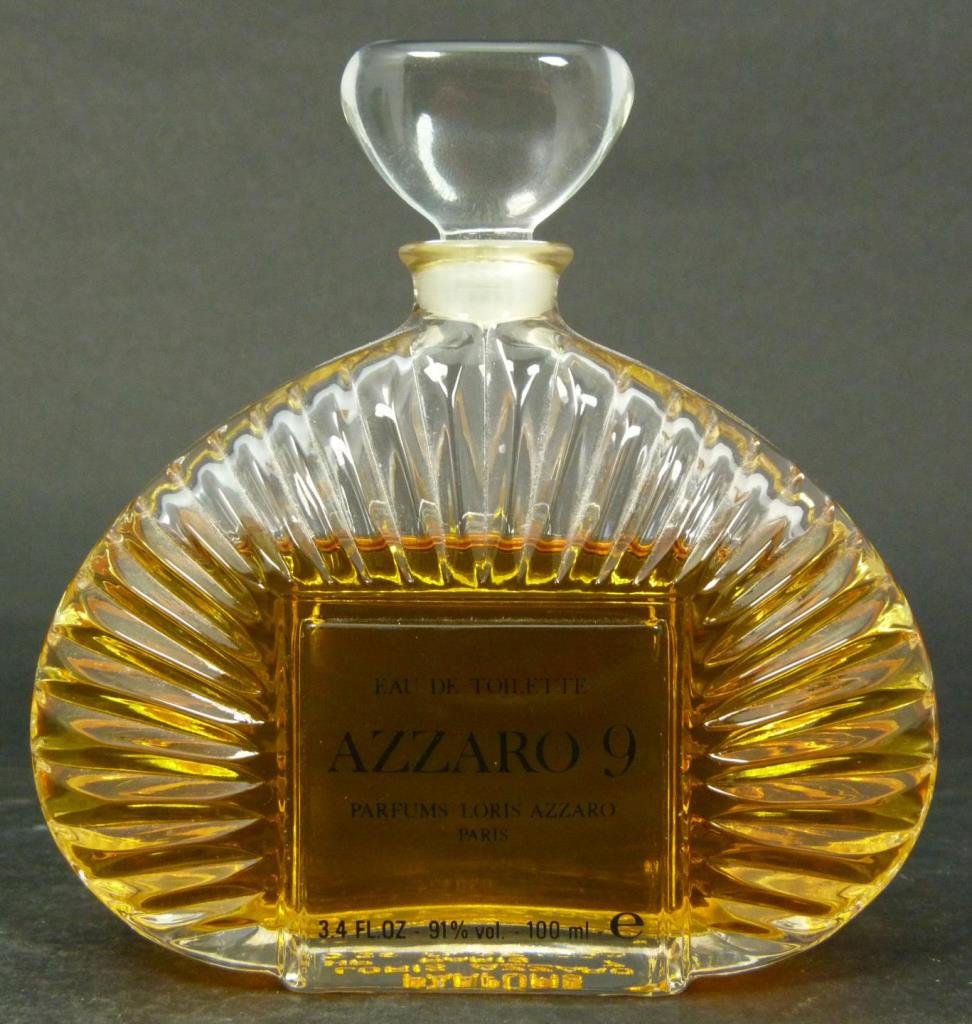 LORIS AZZARO PERFUME BOTTLE 'AZZARO 9' 100ML: Loris Azzaro 100ml perfume in bottle of 'Azzaro 9'. Measures approx. 4 3/8" height (11cm). Total weight approx. 277 grams.