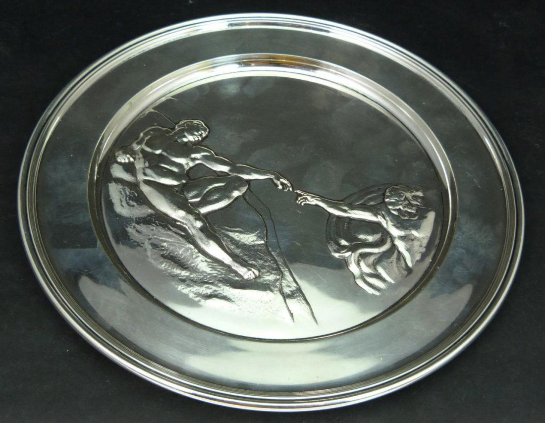 ENGLISH STERLING PLATE 'THE CREATION OF ADAM': Richard Comyns repousse sterling silver plate depicting 'The Creation of Adam' after Michelangelo. Impressed marks to bottom and dated 1972. Measures approx. 9" diameter (22.8cm). Total weight approx.