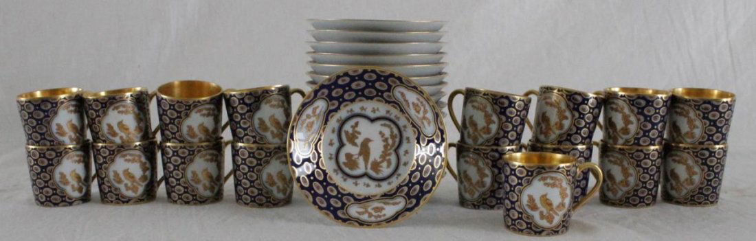 17 B&Co LIMOGES PORCELAIN DEMITASSE & SAUCER SETS: A set of 17 L. Bernardaud & Company Limoges French porcelain demitasse cup and saucer sets. Each with hand painted depicting bird and homestead scenes over cobalt ground. Cups measure approx. 1 7/8" h