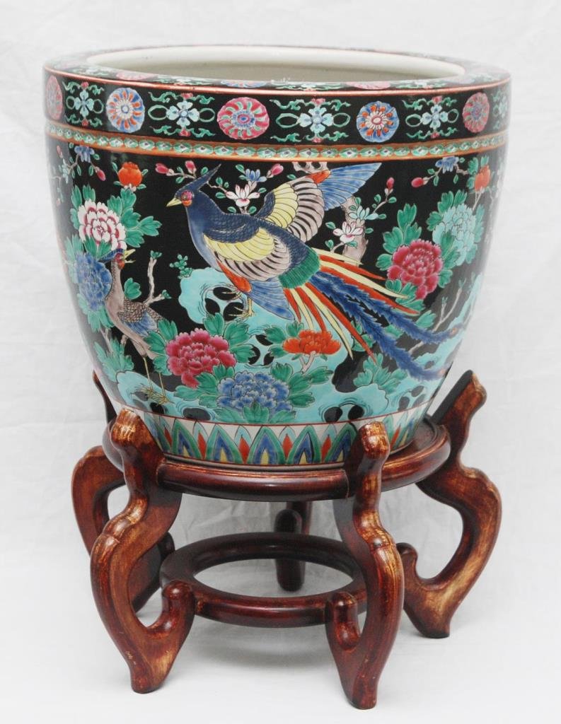 VINTAGE JAPANESE FAMILLE NOIR PORCELAIN PLANTER: A vintage Japanese hand painted Famille Noir fish bowl planter depicting paradise birds amongst flowers over black ground. Marked 'NIPPON' to bottom with character artist mark. Includes fitted wooden 