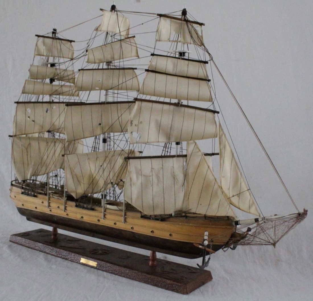 HAND MADE WOODEN FRIGATE 'NAUTILUS' SHIP: A hand made wooden frigate ship with three masts. Mounted on wooden base with map design. Placard to front of base bearing the ship's name 'Nautilus' and date of 1866. Measures approx. 25 1/4" height