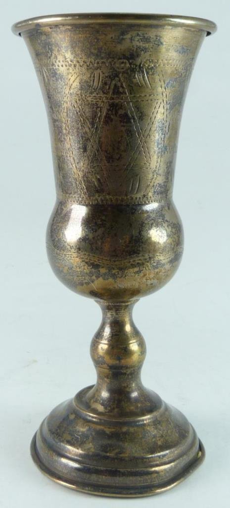 STERLING SILVER CHASED DAVID STAR KIDDUSH CUP: Sterling silver hand chased Kiddush cup depicting the Star of David. Impressed 'M. O. 84 - STERLING' to side of foot. Measures approx. 6" height (15cm). Total weight approx. 3.32ozt.