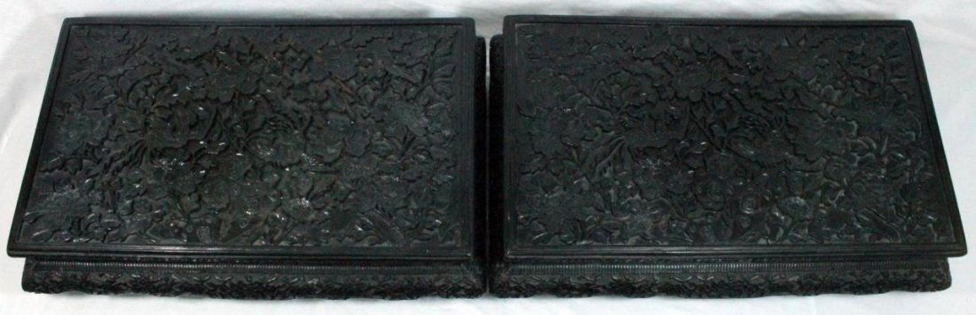 Pr. CHINESE BLACK LACQUERED ORNATE LOW TEA TABLES: A pair of wonderful Chinese heavily relief carved black Cinnabar lacquered wooden low kneeling tea tables. Each depicting paradise birds amongst peony blooms and rock formations. Tables measure approx