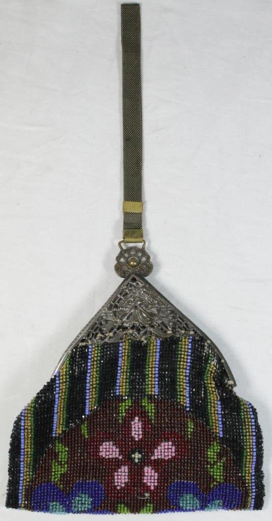 VINTAGE FRENCH BEADED PURSE: A vintage French silver plate frame purse having a micro beaded floral design. Has wrist strap. Purse measures approx. 7" length x 6 1/2" width (18cm x 17cm). Total weight approx. 190 grams.
