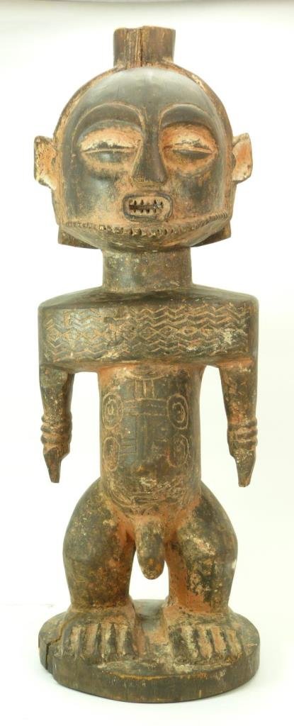 ANTIQUE CARVED AFRICAN FERTILITY IDOL: ANTIQUE CARVED AFRICAN IDOL Measures 21" tall (53.34cm). Early to mid 20th century. Total weight 2075g