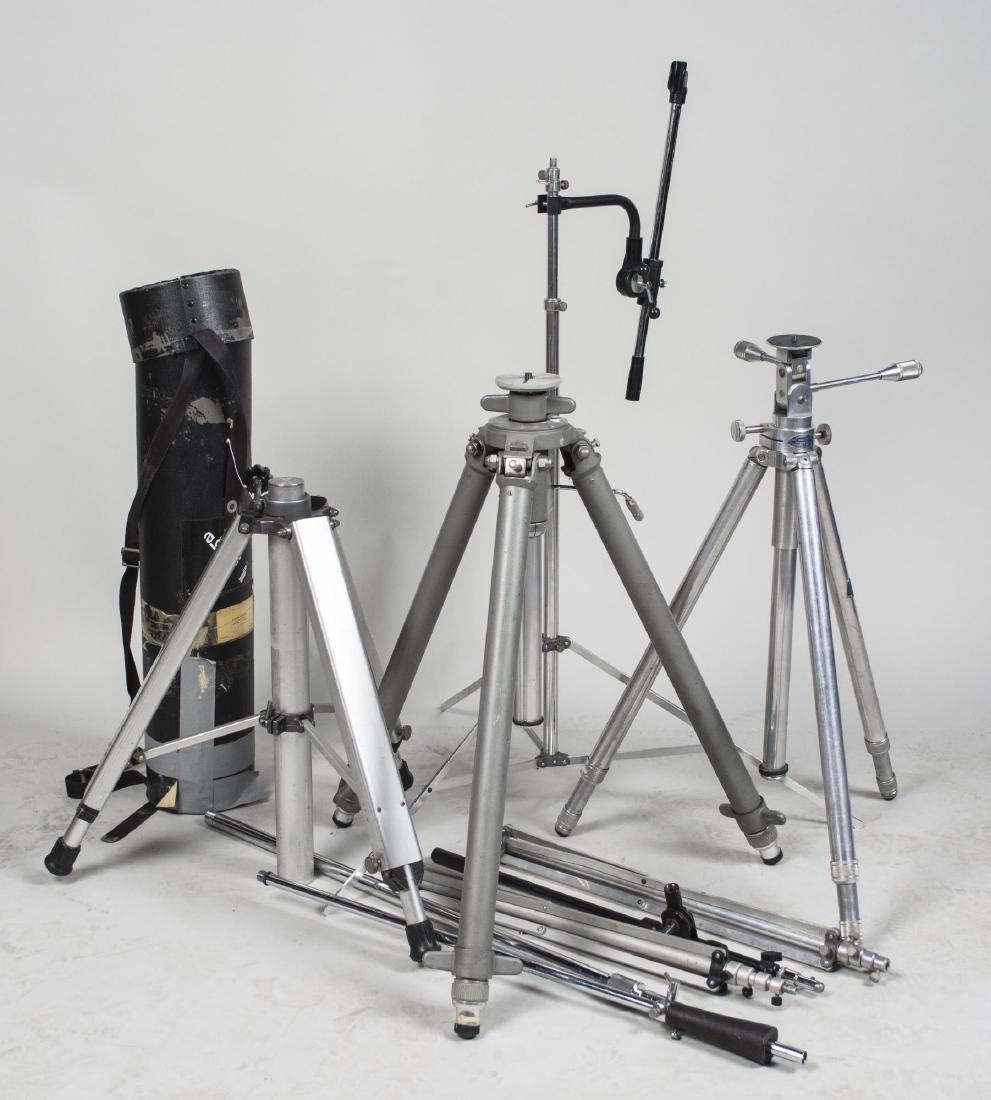 Group of Photo/Video Camera Equipment Stands: Including tripods, lighting and microphone stands. Notice to bidders: Condition reports and additional photographs are provided by request as a courtesy to our clients, as such any condition report is