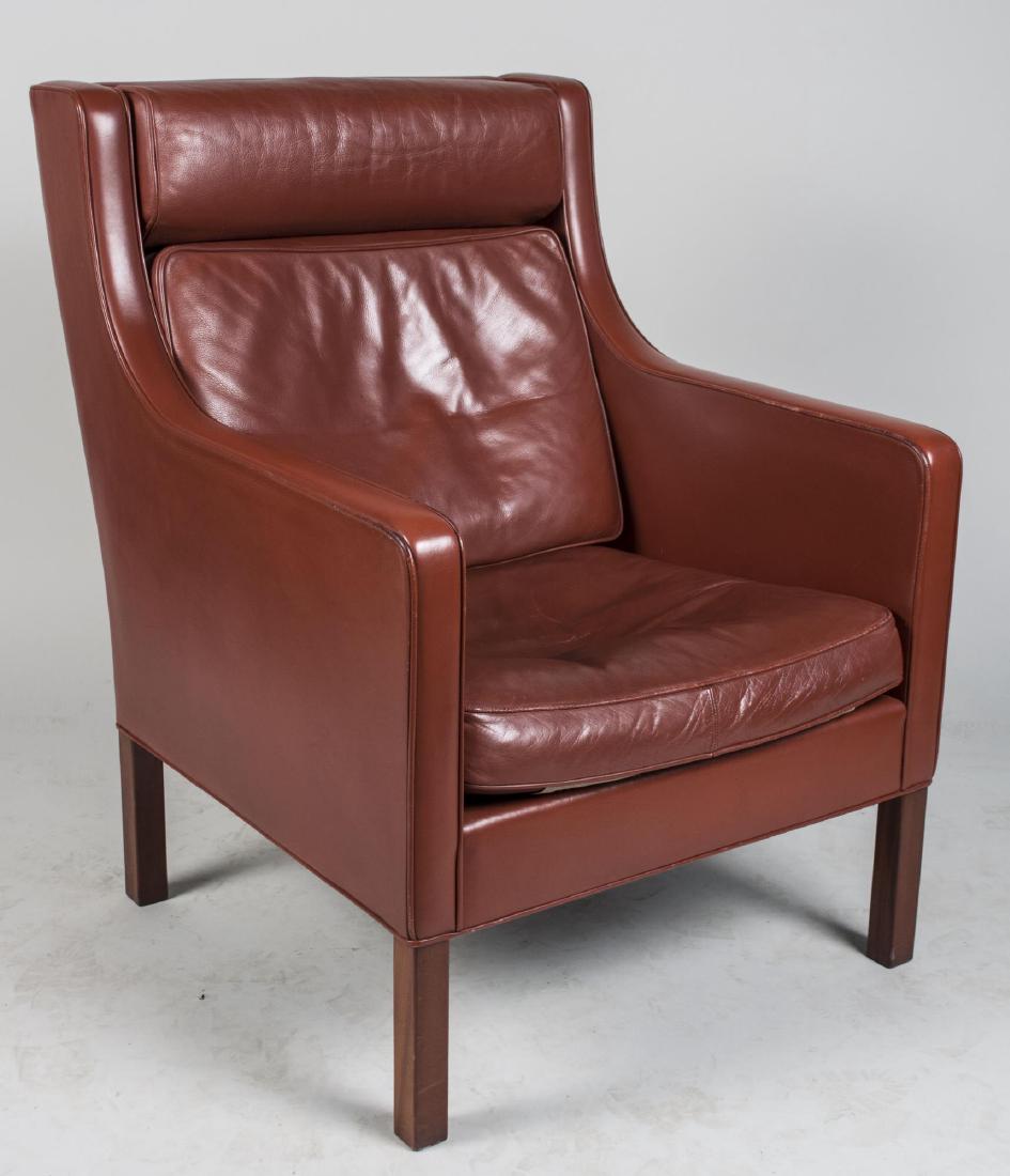Georg Thams Leather Chair: Red leather upholstered, cushion headrest, back and seat, on square block legs. Height 38 inches, width 28 inches, depth 31 inches. Notice to bidders: Condition reports and additional photographs are