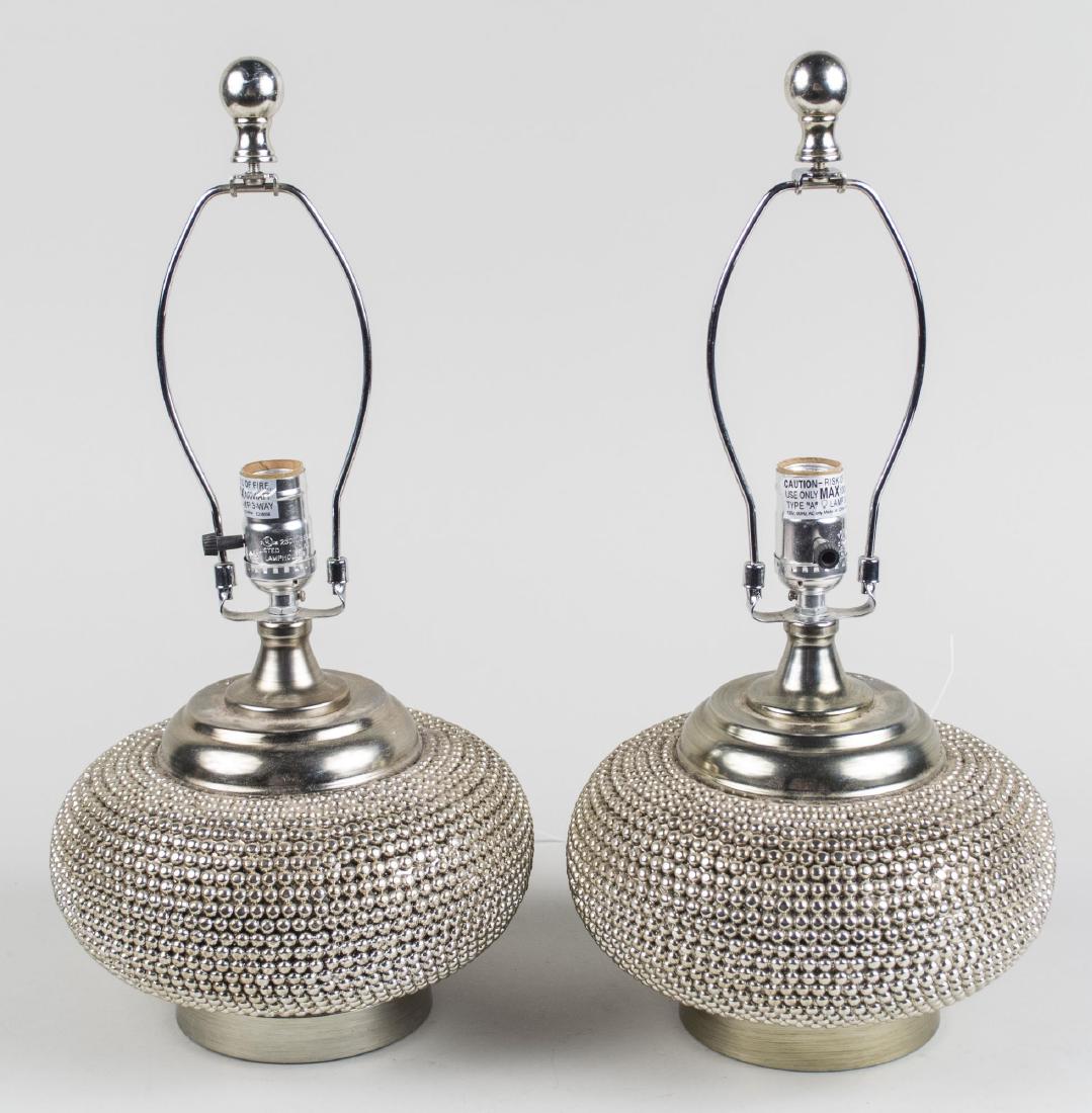Pair of Beaded Lamps: Single light lamps with squat base with bead decoration. Base, height 7 inches. Notice to bidders: Condition reports and additional photographs are provided by request as a courtesy to our clients, as
