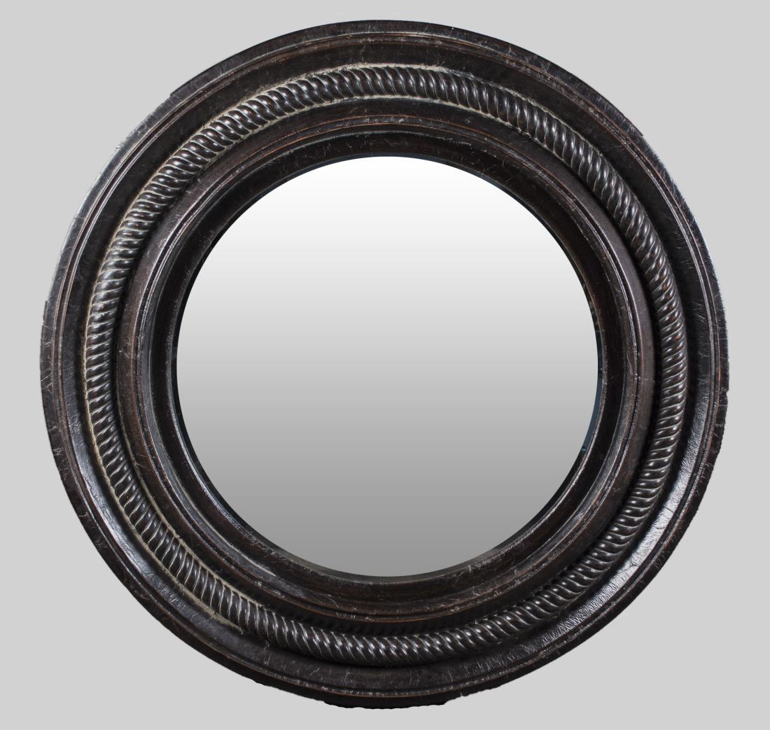 Ralph Lauren Mirror: Circular ebonized wood frame. Diameter 57 inches. Notice to bidders: Condition reports and additional photographs are provided by request as a courtesy to our clients, as such any condition report is 
