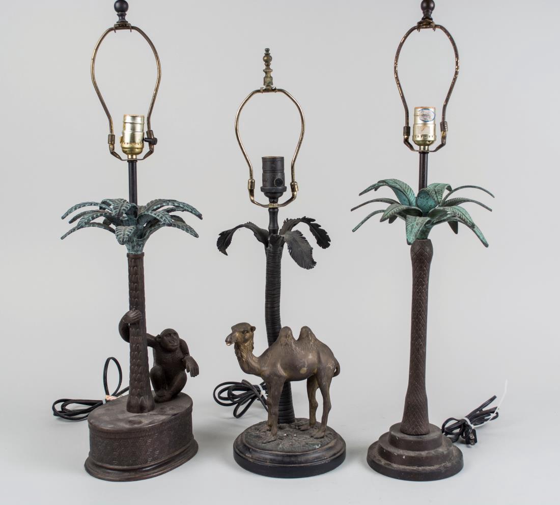 Three Patinated Bronze Lamps *: One, a monkey under a palm tree, another a camel under a palm tree and another a palm tree. Tallest base height 22 inches. Notice to bidders: Condition reports and additional photographs are provided