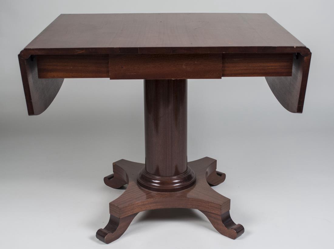 Mahogany Drop Leaf Pedestal Table: 19th century, rectangular top with two drop leaves on a column with quatrepartite base. Closed, height 29 inches, width 36 inches, depth 27 1/2 inches, leaf width 10 inches. Notice to bidders: Conditi