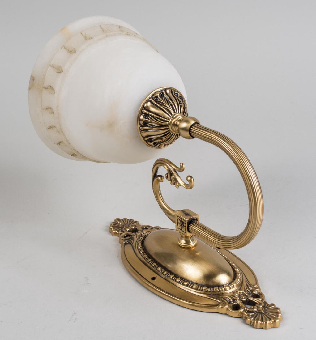 Set of Four Alabaster Wall Sconces: Brass two light sconces with vase form alabaster shades. Height 11 1/2 inches. Notice to bidders: Condition reports and additional photographs are provided by request as a courtesy to our clients, as 