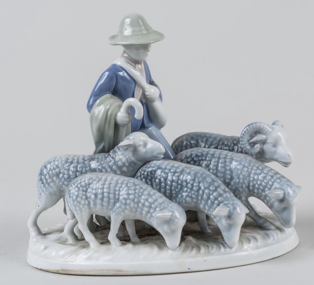 Bavarian Porcelain Figure Group: Shepherd with ram and four sheep, marked made in Western Germany. Height 6 1/4 inches. Notice to bidders: Condition reports and additional photographs are provided by request as a courtesy to our clie