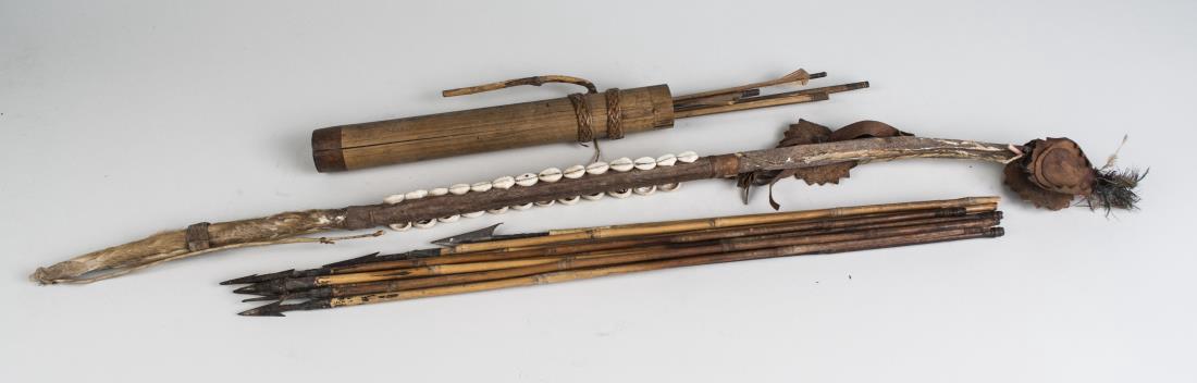 African Bow and Arrows: With applied shell decoration, together with blowgun darts in a case. Bow length 35 1/2 inches. Notice to bidders: Condition reports and additional photographs are provided by request as a courtesy to