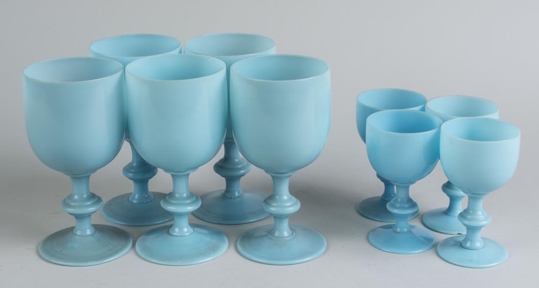 Nine Blue Opaline Glass Stemware Articles: Five goblets and four cordials. Goblet, height 6 1/2 inches. Notice to bidders: Condition reports and additional photographs are provided by request as a courtesy to our clients, as such any condition