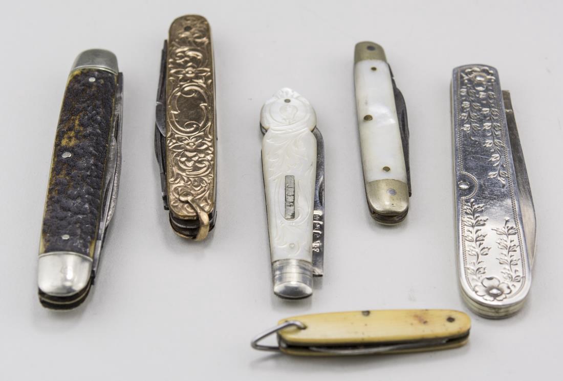Group of Six Pocket Knives: Including two mother of pearl handle knives, a gold filled knife, etc. Notice to bidders: Condition reports and additional photographs are provided by request as a courtesy to our clients, as such any