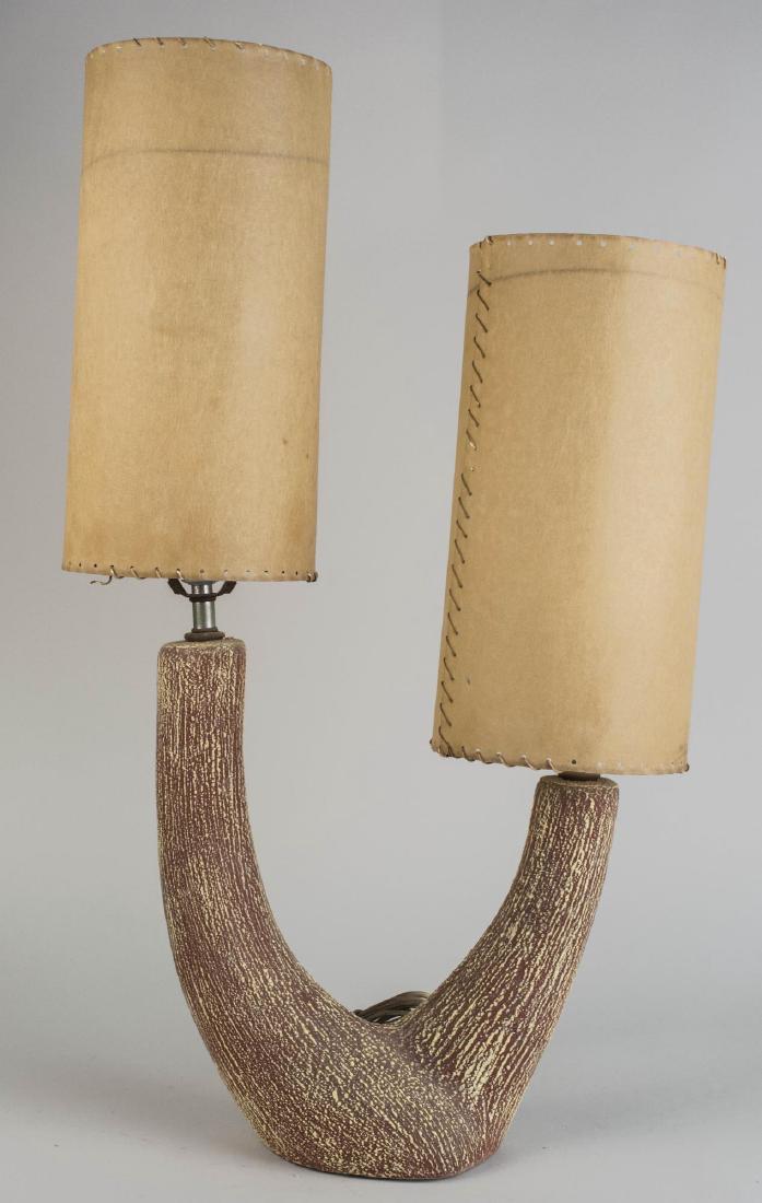 Simulated Horn Lamp: Two light lamp with paper shades. Height overall 24 inches. Notice to bidders: Condition reports and additional photographs are provided by request as a courtesy to our clients, as such any condition 