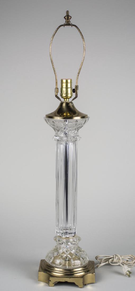 Colorless Glass Column Lamp: Single light lamp, neoclassical style, fluted column on a square base with cut corners. Height 21 inches. Notice to bidders: Condition reports and additional photographs are provided by request as a c