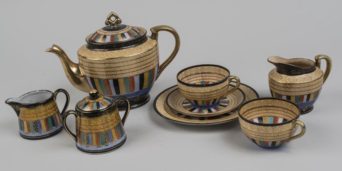 Japanese Porcelain Tea Set: Including a teapot, milk jug, cream jug, sugar bowl, two cups and a saucer and serving plate. Teapot, height 7 inches. Notice to bidders: Condition reports and additional photographs are provided by r