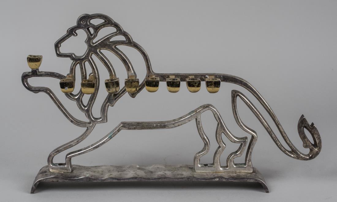 Lion Menorah: Rosenthal Judaica Collection, in fitted box. Notice to bidders: Condition reports and additional photographs are provided by request as a courtesy to our clients, as such any condition report is only 