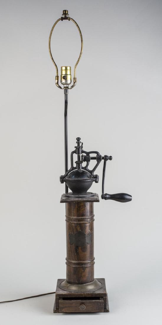 Grinder Lamp: Single light lamp, mounted on a coffee grinder. Height 21 1/2 inches. Notice to bidders: Condition reports and additional photographs are provided by request as a courtesy to our clients, as such any 