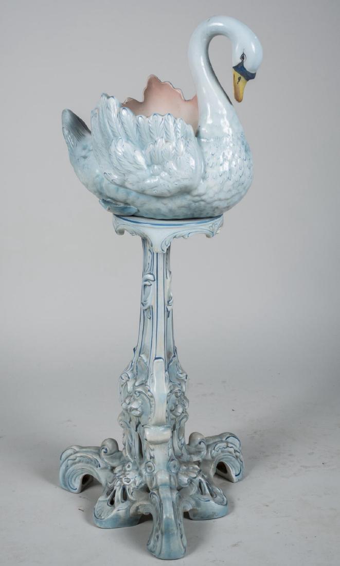 Swan Jardiniere and Stand: Height 40 inches. Notice to bidders: Condition reports and additional photographs are provided by request as a courtesy to our clients, as such any condition report is only an opinion and should not b