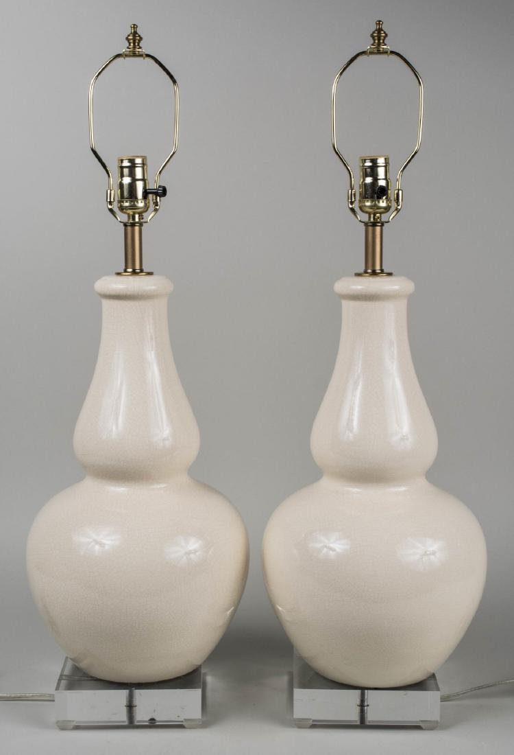 Pair of Crackle Glaze Table Lamps: Vase form single light lamps. Base, height 19 inches. Notice to bidders: Condition reports and additional photographs are provided by request as a courtesy to our clients, as such any condition report
