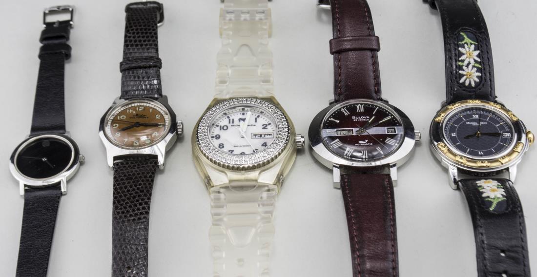 Group of Men's Watches: Comprising two Movado, a Michel Jordi, Bulova, Mido and Technomarine. Notice to bidders: Condition reports and additional photographs are provided by request as a courtesy to our clients, as such any