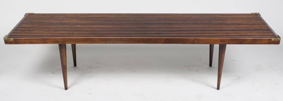 Mid Century Coffee Table: In the style of George Nelson. Height 14 inches, width 60 inches, depth 18 inches. Notice to bidders: Condition reports and additional photographs are provided by request as a courtesy to our clients,