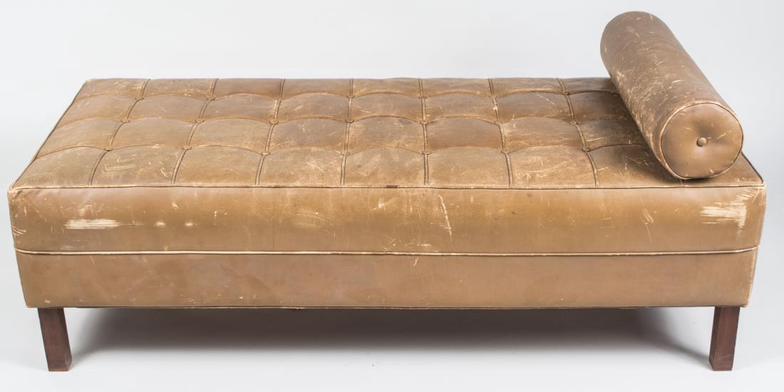Brown Leather Bench: Button tufted upholstered bench / bed with roll pillow. Height 17 inches, width 56 inches, depth 25 inches. With rock cushion. Notice to bidders: Condition reports and additional photographs are provi