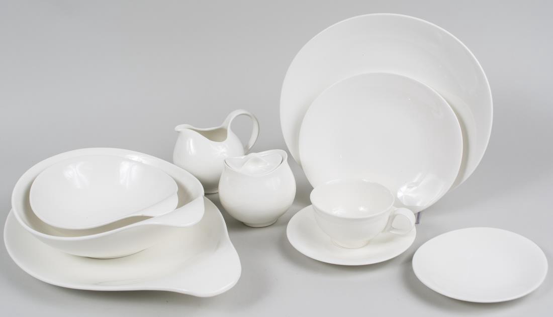 Hallcraft Eva Zeisel Service: Hallcraft White pattern, comprising six dinner plates, six cups and saucers, platter, two bowls and three small plates. Notice to bidders: Condition reports and additional photographs are provided by