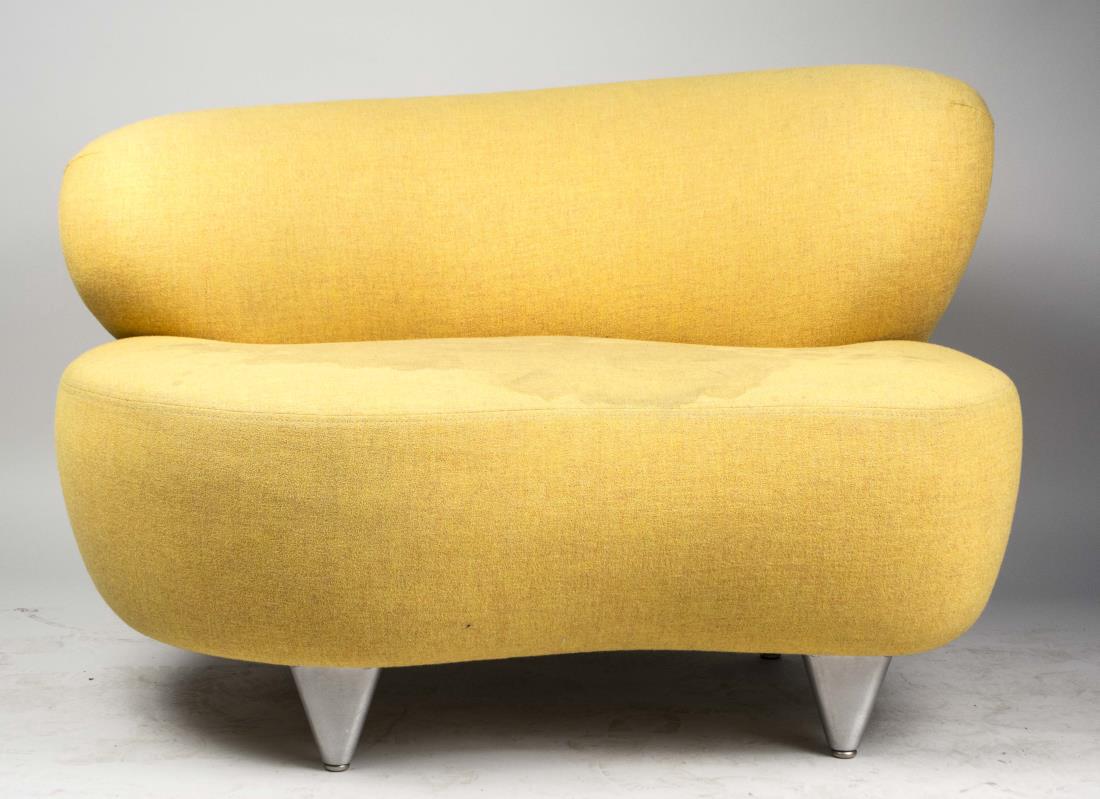Modernica Cloud Chair: Yellow fabric upholstery, amorphous back and seat on tapered legs. Height 29 inches, width 43 inches, depth 36 inches. Provenance: From the Collection of Debra Newhouse Notice to bidders: Condition re