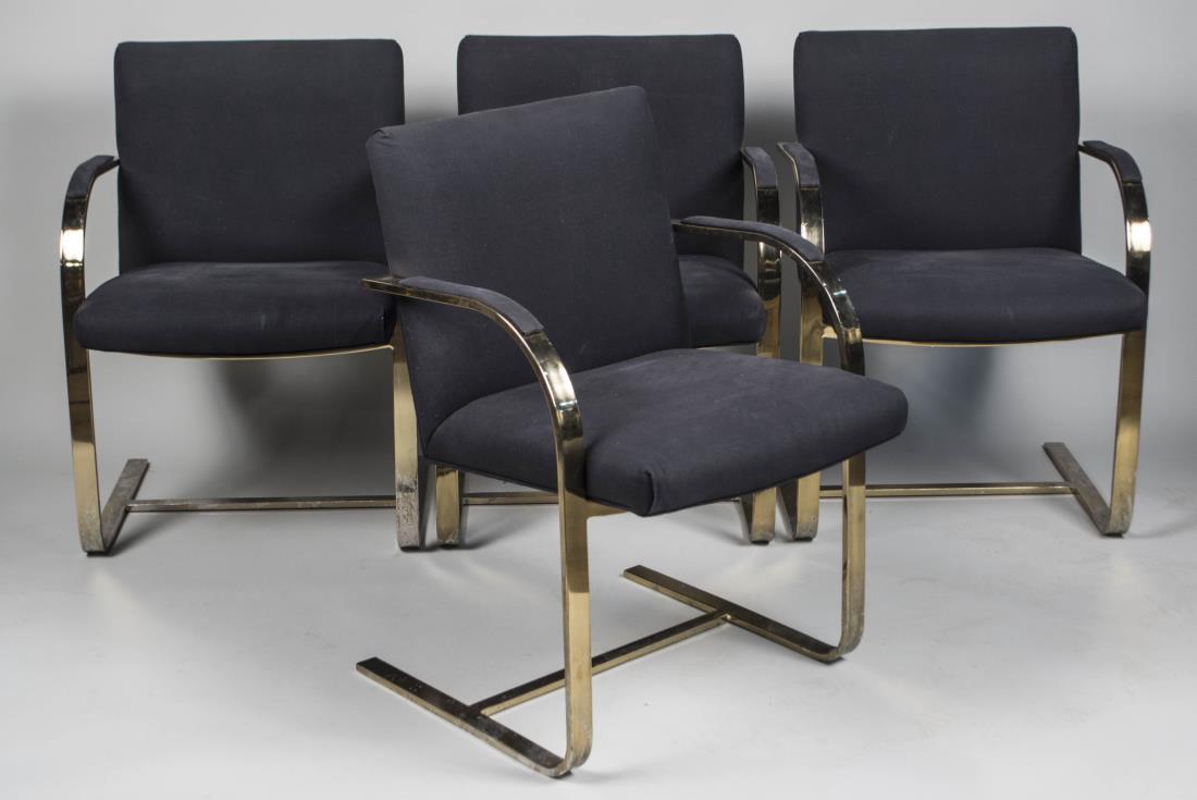 Set of Four Marcel Breuer Style Armchairs: Each with dark blue upholstered back and seat on a brass finish frame. Height 32 inches, width 23 inches, depth 25 inches. Notice to bidders: Condition reports and additional photographs are provided