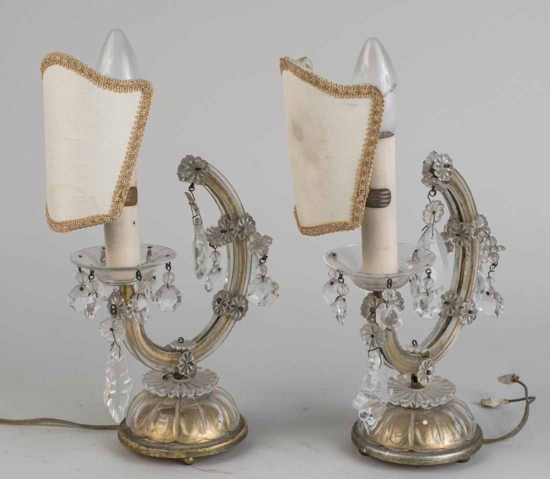 Pair of Boudoir Lights: Each a single candle light hung with prisms and with a fabric shade. Height 10 inches. Notice to bidders: Condition reports and additional photographs are provided by request as a courtesy to our clie