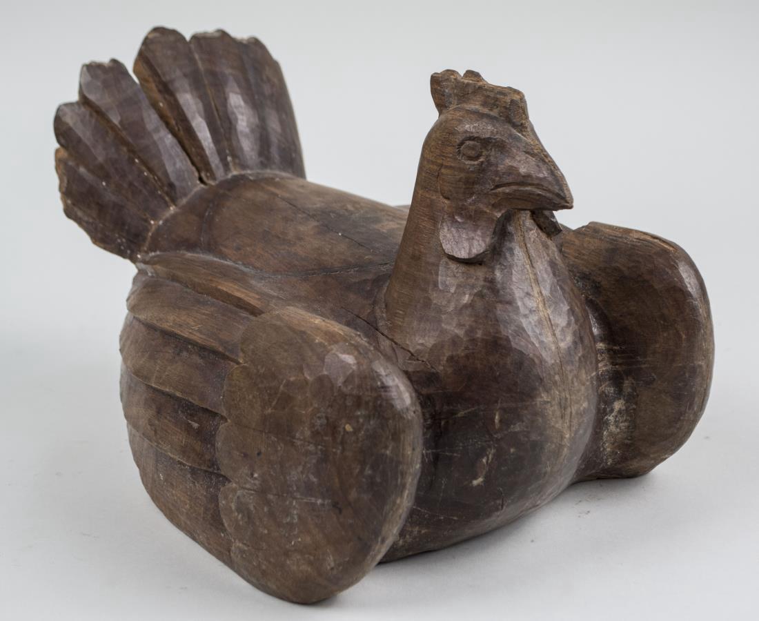 Carved Wood Hen: Carved in reclining position. Height 8 1/2 inches, length12 1/2 inches. Notice to bidders: Condition reports and additional photographs are provided by request as a courtesy to our clients, as such an