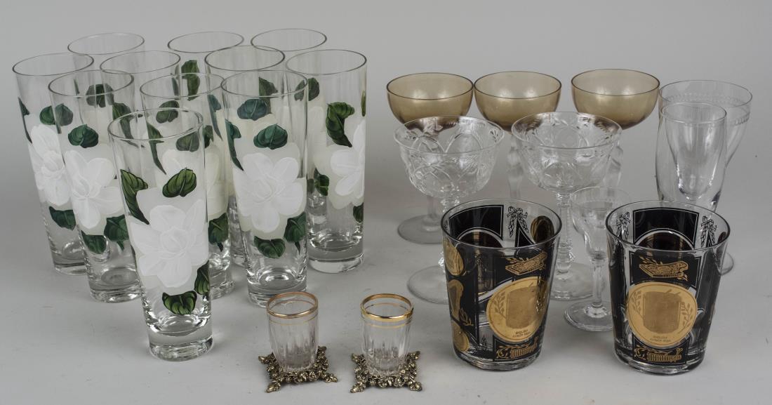 Group of Glassware and Barware: Approximately twenty three pieces, including a set of eleven high ball glasses. Various sizes. Notice to bidders: Condition reports and additional photographs are provided by request as a courtesy to 