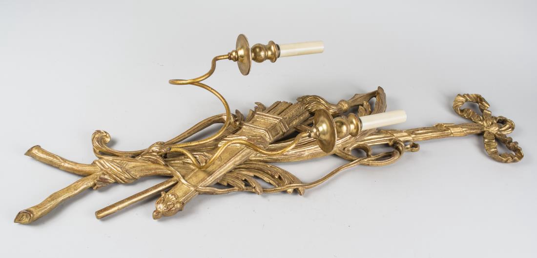 Pair of Gilt Wood Sconces: Neoclassical style, two light sconces, decorated with bow ribbons suspending a quiver with arrows. height 36 inches. Notice to bidders: Condition reports and additional photographs are provided by req