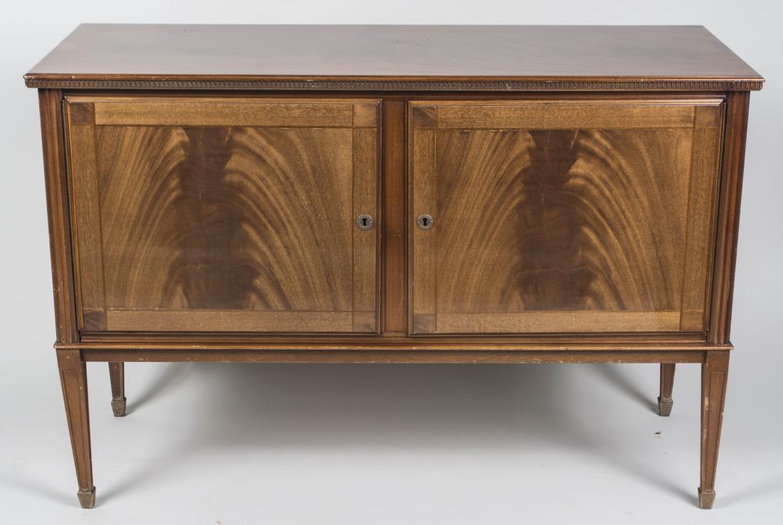 Empire Style Mahogany Side Cabinet: Rectangular top over two flame mahogany paneled doors, tapered square legs. Height 32 inches, width 47 inches, depth 19 inches. Notice to bidders: Condition reports and additional photographs are prov