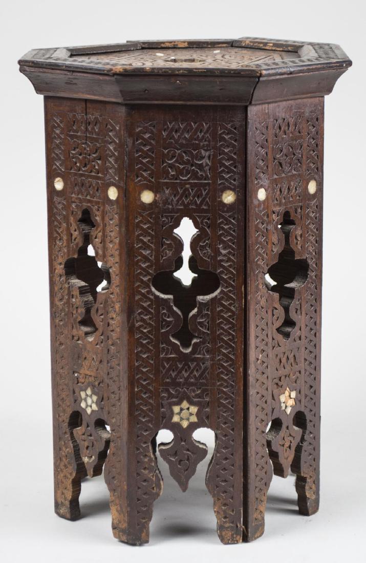 Syrian Low Table: Octagonal top with geometric decoration and bone inlay. Height 15 inches, 10 inches square. Notice to bidders: Condition reports and additional photographs are provided by request as a courtesy to our