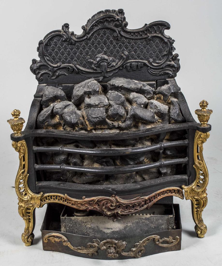 Rococo Style Iron Fire Hearth: With brass trim. Height 30 inches, width 26 inches, depth 12 inches. Notice to bidders: Condition reports and additional photographs are provided by request as a courtesy to our clients, as such any c
