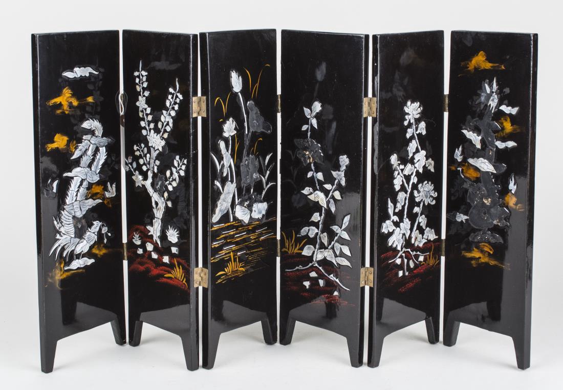 Chinese Lacquered Table Screen: Six folding panels decorated with flowers. Height 11 inches, width of each panel, 4 1/2 inches. Notice to bidders: Condition reports and additional photographs are provided by request as a courtesy to