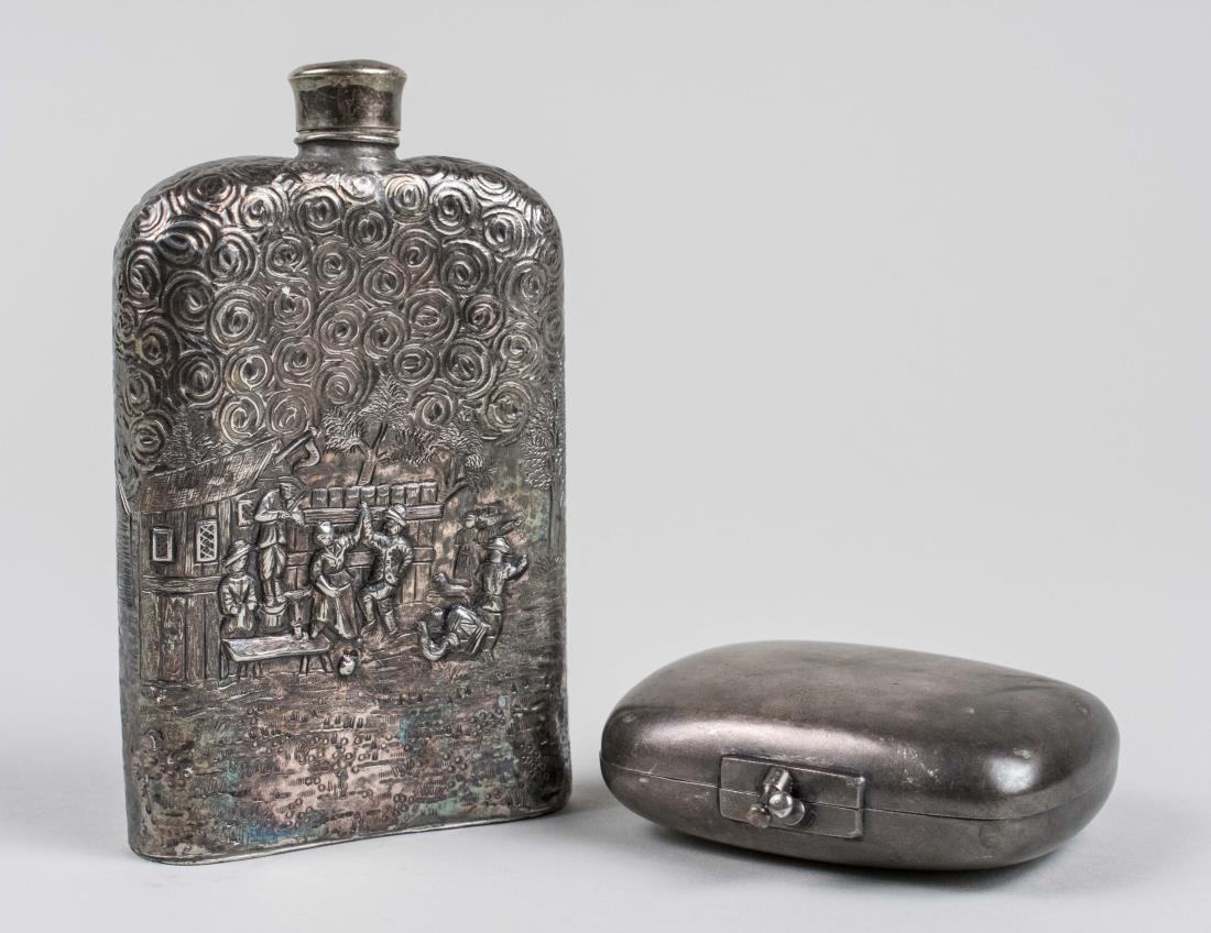Derby Silver Plated Flask and Box: Flask with raised decoration of figures making merry, height 6 1/8 inches; together with a silvered metal box 4 x 2 3/4 inches. Notice to bidders: Condition reports and additional photographs are prov
