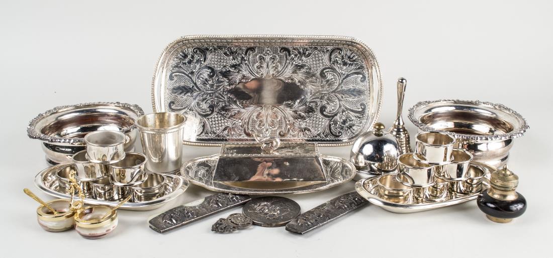 Group of Silver Plated Table Articles: Including a galleried drinks tray, a pair of wine coasters, bell, set of napkin rings, butter dish, etc. Drinks tray, length 12 inches. Notice to bidders: Condition reports and additional photographs