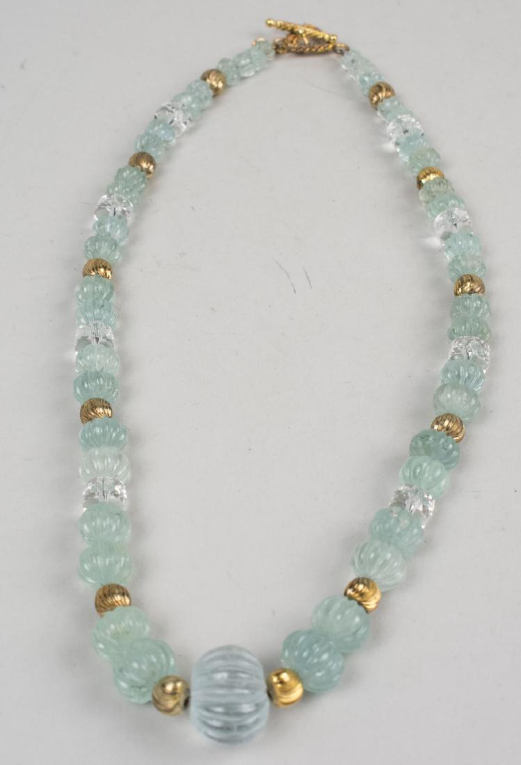 Rock Crystal and Gemstone Bead Necklace: Single strand of graduated melon carved beads accented with rock crystal and gold filled beads. Length 19 inches. Notice to bidders: Condition reports and additional photographs are provided by reques