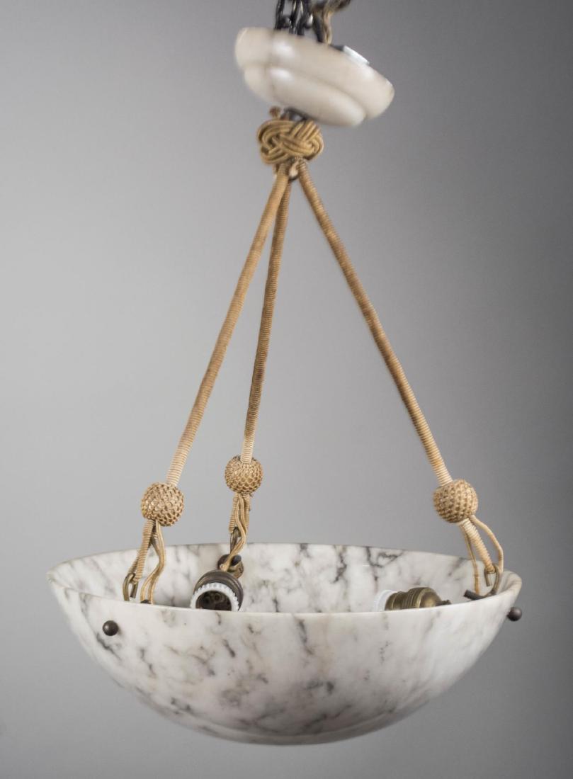Alabaster Fixture: Inverted dome shaped shade with three interior lights. Height 19 inches, diameter 14 inches. Provenance: From the Collection of Debra Newhouse Notice to bidders: Condition reports and additional photo