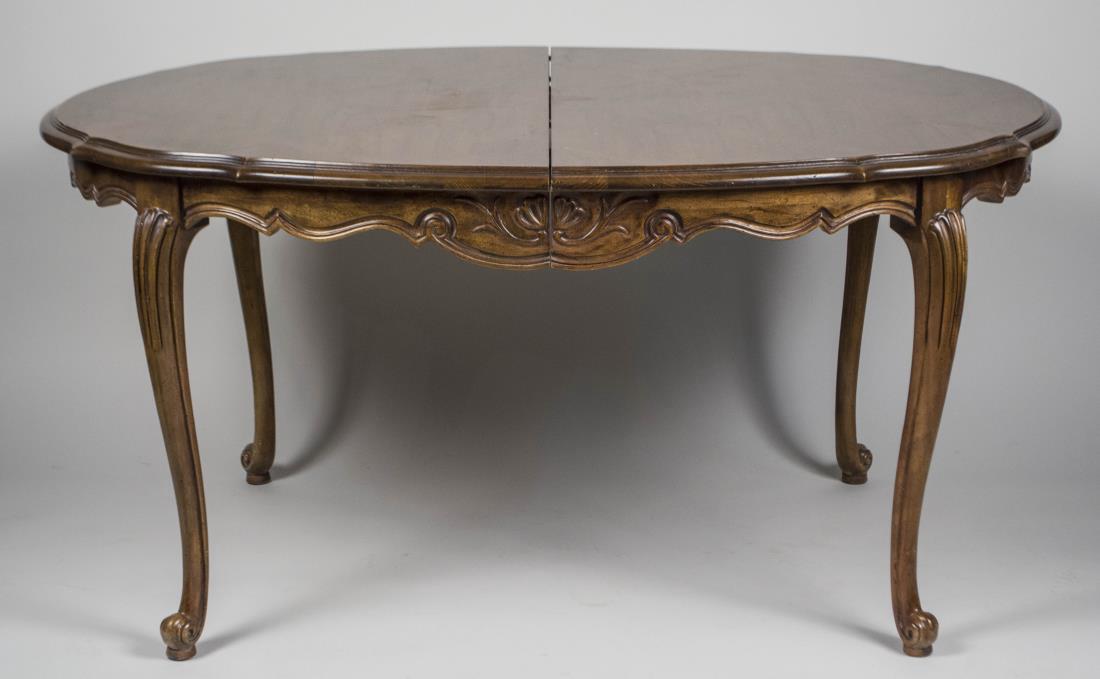 Fruitwood Extension Dining Room Table: Oval top with shaped frieze, on cabriole legs, two additional leaves. Height 30 inches, width 63 inches, depth 43 inches. Leaf width 15 inches. Notice to bidders: Condition reports and additional phot